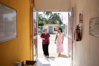 Patient and Service Manager at Casa Materna arriving to Casa Materna in Jaltenango for a consultation.