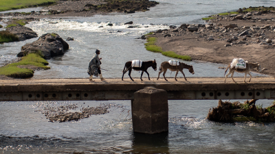 A one-lane bridge connects the mountainous terrain in Lesotho, where PIH provides lifesaving care.