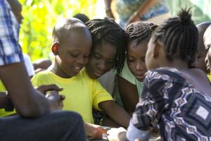 Children read a book together