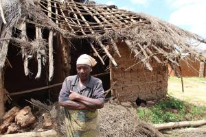 Woman in front of her home in Malawi