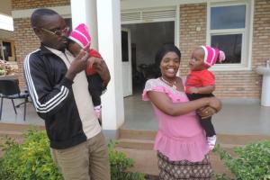 Parents play with daughters in Rwanda