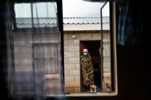 Molato Mahae, a patient with multidrug-resistant tuberculosis, awaits medication distribution at the halfway house in Maseru, Lesotho.