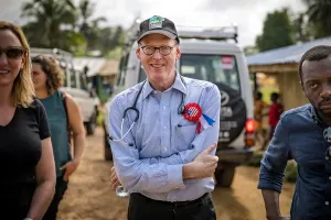 Dr. Paul Farmer in Pleebo, Liberia with a group of people
