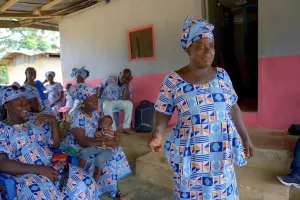 Cecelia Green shares her personal story to the Gedetarbo Women’s Group, Clan Chief, and others in Maryland County, Liberia.