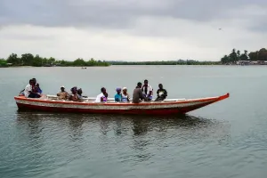 Residents of Puluken cross the Hoffman River on the Puluken Town Canoe in July 2024.