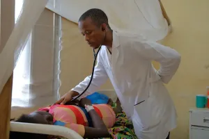 Dr. Kangar O. Diggs, a family medicine resident, examines a patient.