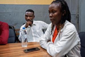 Peter J. Wallace (left), 23, during a peer support group session at PIH-supported J.J. Dossen Memorial Hospital in Maryland County, Liberia.