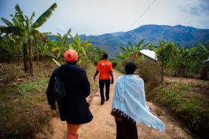 Partners In Health staff in Rwanda walk to a patient’s home in Burera District, Rwanda. 