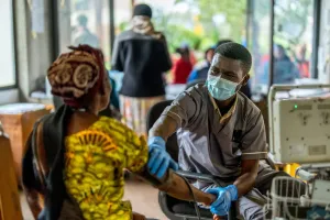 Nurse taking patient's blood pressure at Butaro Level II Teaching Hospital