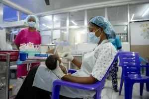 A nurse feeds a newborn in the special care baby unit at PIH-supported Koidu Government Hospital where a team of doctors and nurses provide advanced, lifesaving care for premature and otherwise endangered babies. 