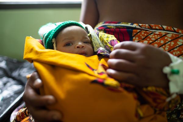 Mary Samson, 21, holding newborn daughter Hannah.