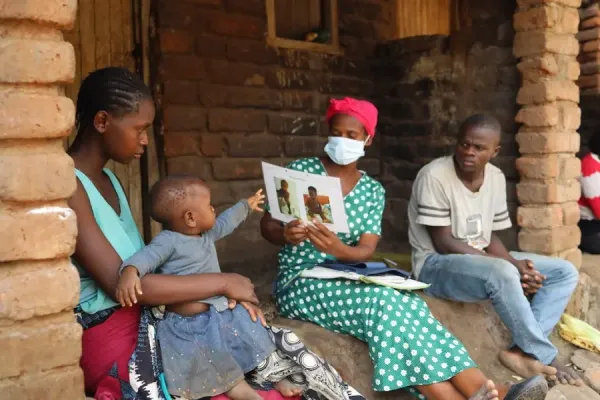 Community health worker Catherine Benito visits a household in Neno District, Malawi.