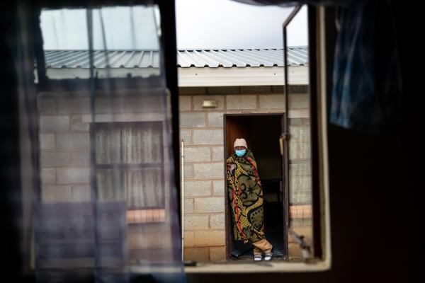 Molato Mahae, a patient with multidrug-resistant tuberculosis, awaits medication distribution at the halfway house in Maseru, Lesotho.