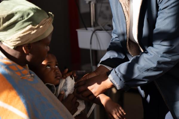 Monnica Maheso sees 3-year-old 'Mafusi Sekete at Nkau Health Center.