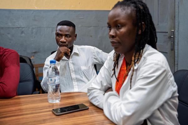 Peter J. Wallace (left), 23, during a peer support group session at PIH-supported J.J. Dossen Memorial Hospital in Maryland County, Liberia.