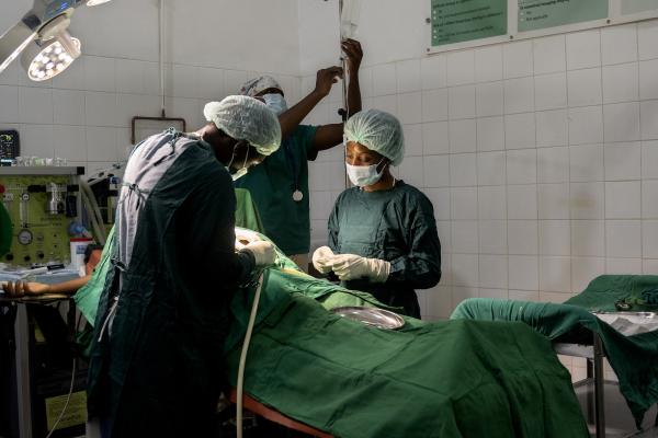 Doctors and nurses from Partners In Health and Ministry of Health  perform a C-section at Neno District Hospital in Malawi.