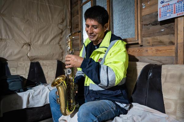 Elvis Espinosa holds his saxophone, an instrument he thought he'd never touch again after he was diagnosed with extensively drug-resistant tuberculosis.