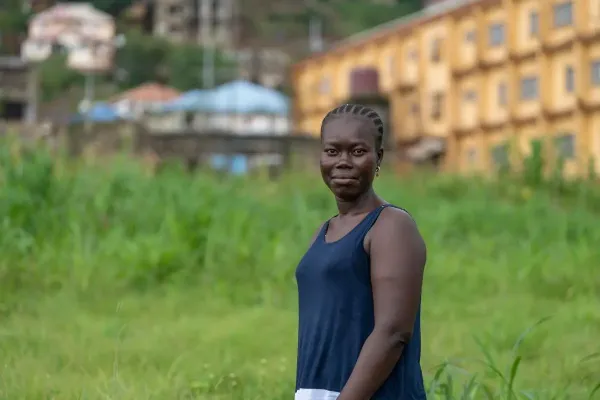 Saio Kamara poses for a portrait outside of Lakka Government Hospital in August 2023. 