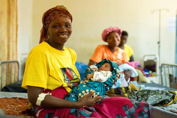 Kumba Sandy holds her newborn baby boy on the day they are being discharged to go home after giving birth at Koidu Government Hospital in Sierra Leone. She had been transferred to KGH due to complications during her pregnancy. This is her fifth child and fourth boy.