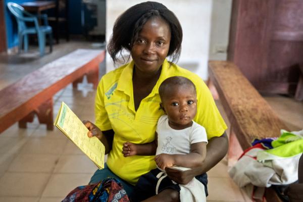 Elizabeth John holds her 6-month-old son Edward.
