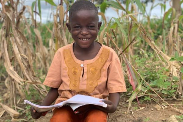 Young boy holding a book