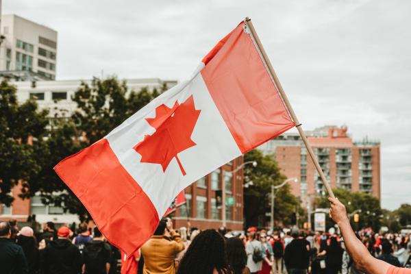 Waving a Canadian flag
