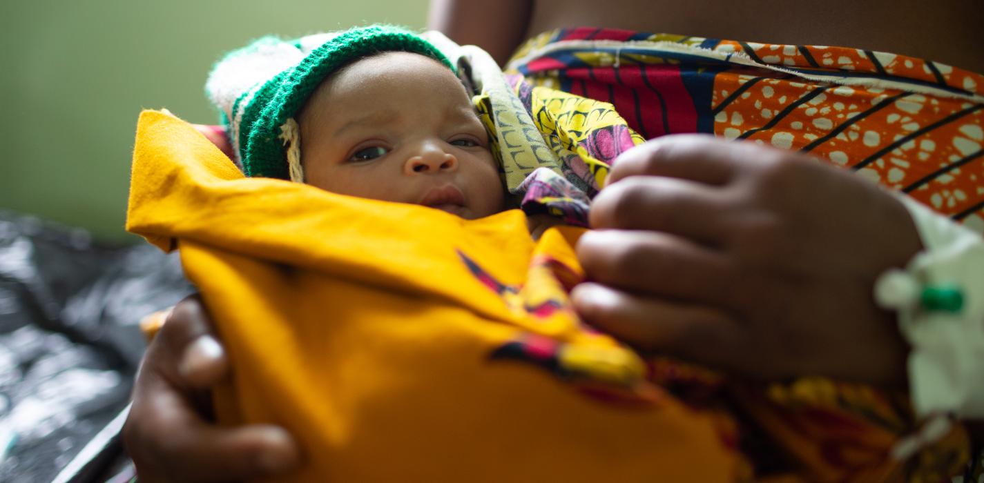 Mary Samson, 21, holding newborn daughter Hannah.