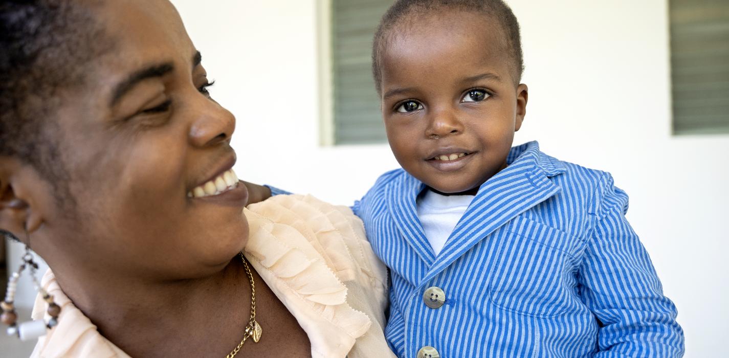 Cherlie St Fleur and baby Henry Monay, outside of the conference room at the Mirebalais University Hospital.