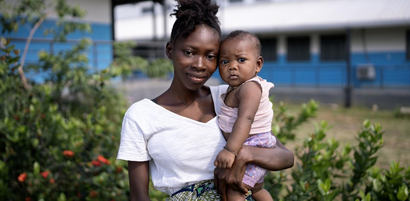 Fatimata Foday holds her six-month old baby girl Bintu