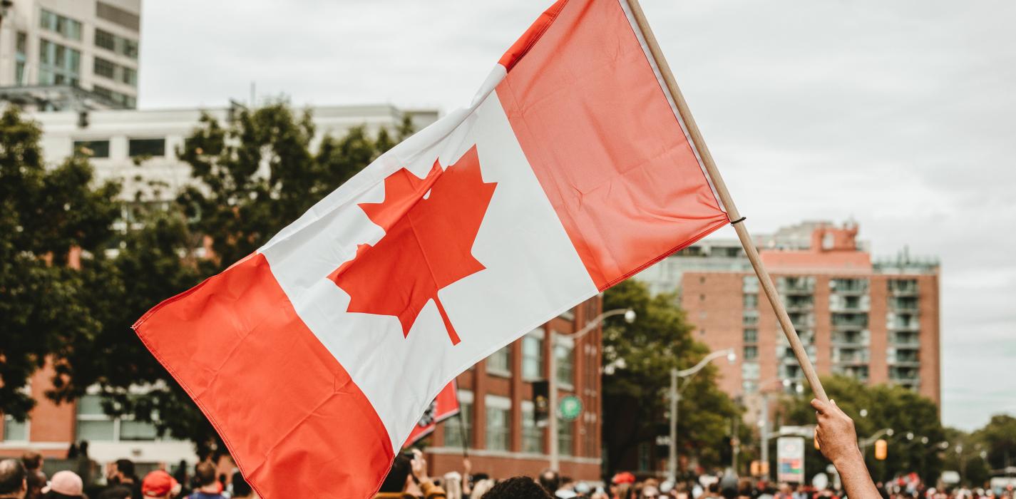 Waving a Canadian flag