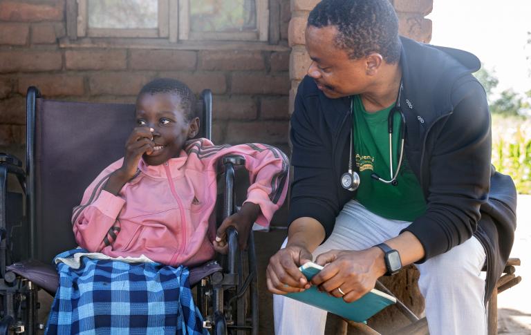 TB program manager for PIH Malawi, conducts a home visit