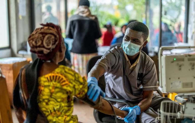 Nurse taking patient's blood pressure at Butaro Level II Teaching Hospital