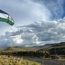 Lesotho flag flies over the highlands. 