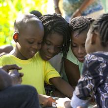 Children read a book together