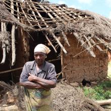 Woman in front of her home in Malawi