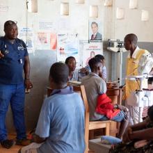 Physician's assistant and patients at J.J. Dossen Hospital in Harper, Liberia.