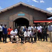 Mark Brender, PIH Canada's National Director, and Tilak Acharya, Director of Finance and Administration, pose for a photo with the Malawi team.