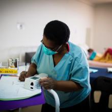 Nurse records patient information in MDR-TB ward in Lesotho