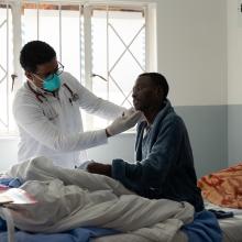 Dr. Eyob Deyaso Biyene examines MDR-TB patient Mokoto Kotelo during morning rounds.