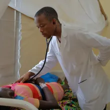 Dr. Kangar O. Diggs, a family medicine resident, examines a patient.