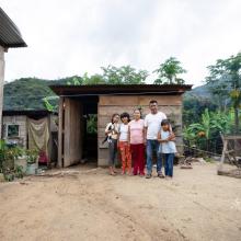 Ariadna stands with her family in their home in Plan de la Libertad in Chiapas, Mexico. Photo by Masao Yanome for PIH.
