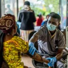 Nurse taking patient's blood pressure at Butaro Level II Teaching Hospital