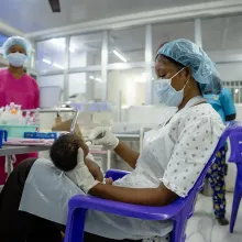 A nurse feeds a newborn in the special care baby unit at PIH-supported Koidu Government Hospital where a team of doctors and nurses provide advanced, lifesaving care for premature and otherwise endangered babies. 