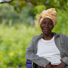 Community Health Workers in Kono District visit Isatu Kargbo at her home in Sierra Leone, 2023