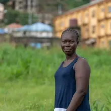 Saio Kamara poses for a portrait outside of Lakka Government Hospital in August 2023. 