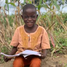 Young boy holding a book