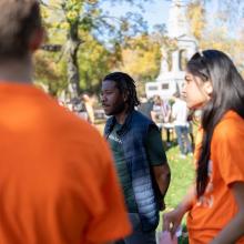 PIH trustee and former patient Ancito Etienne (centre) joins students for a Global Day of Action in Cambridge, MA.