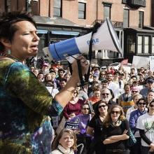 Dr. Joia Mukherjee speaks at a rally