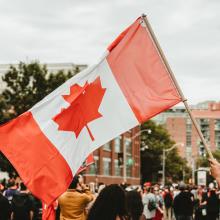 Waving a Canadian flag