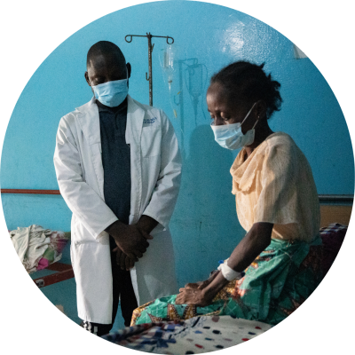 Physicians assistant Theophilus Dolo and Kadiatu A. Konneh, MDR-TB physicians assistance, follow up with tuberculosis patient Hawa John at the TB Annex in Monrovia.